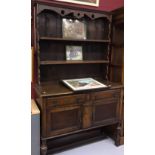 20th cent. Oak dresser: The base has two drawers and a two door cupboard with square on turned