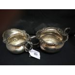 Hallmarked Silver: Bowl and cream jug with ornate decorated rims, London marks, maker H.S.,