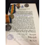 Medals: A pair to 150275 GNR E.W. Baker RF a miniature set with wound badge and certificate of