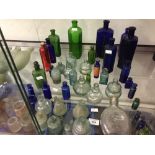 Bottles: 19th cent. & later medicine, lotion, tinctures tonic glass bottles in blues, green & red.