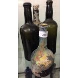 Bottles: 18th cent. & later Green iridescent liqueur bottles one mallet shaped. 11ins. to 8ins. (