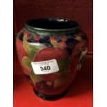 Moorcroft - The Newman Collection: c1916 Baluster vase, pomegranate pattern on dark blue ground,