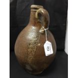 17/18th cent. Brown Salt glazed Bellarmine jug, 11ins.