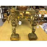 20th cent. Brass, ornate candlesticks with 'Putti' plinths. Branch for three candles, lead filled