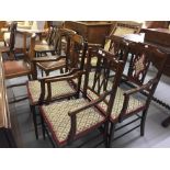 Edwardian mahogany harlequin salon suite with upholstered seating. Inlaid banding.