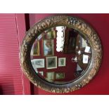 Mirror: Circular bevel edge mirror, carved frame depicting nuts and berries, 15ins. diameter.
