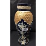 20th cent. Royal Doulton blue ground, baluster vase, gilt turning to the shoulders. 11ins.