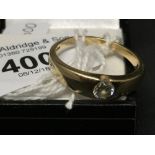 Hallmarked Gold: 9ct. Tapering plain signet ring set with flush rub-over. 0·60ct. round brilliant