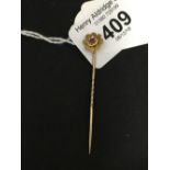 Hallmarked Gold: 9ct. Floral tie pin with ruby centre, approx. 2ins. 1gm.