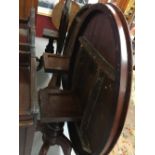 19th cent. Mahogany oval tilt top table, single turned column on 4 splayed supports.