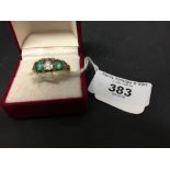 Diamond & Emerald Jewellery: Boat shaped ring, centre stone ·75 plus two others ·10, emeralds cut