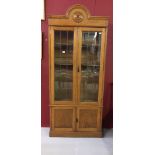 20th cent. Oak dome topped, lead glazed bookcase with twin solid doors below. 34ins. x 80ins. x