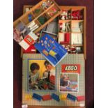 Toys: Lego System (1959), in treen box. Two build bases, Lego blocks, wheels, flags, trees, signs,