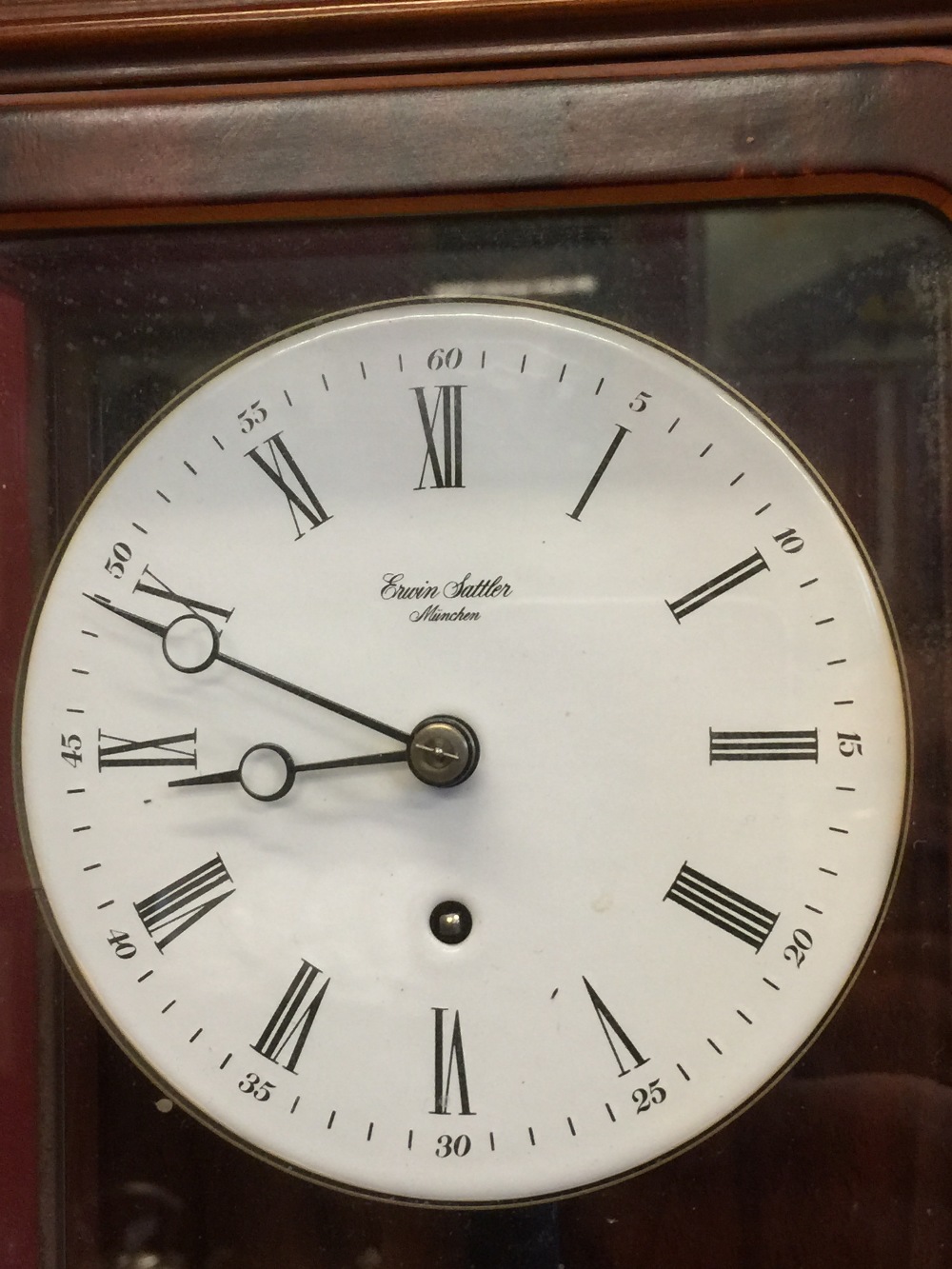 20th cent. Wall clock, mahogany and glass case. Erwin Sattler, Manchester. 6ins. x 24ins. x 3½ins. - Image 2 of 2