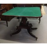 19th cent. Flame mahogany fold-over swivel card table on four supports.