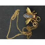 Hallmarked Gold: 9ct. Bee/moth pendant set with ruby eyes and sapphire wings on a fine chain 4·