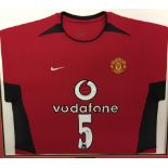Football: Signed Rio Ferdinand '5' Manchester United home shirt. Framed and mounted.