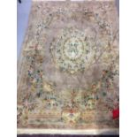 Rugs: Chinese washed rug, beige ground, floral pattern. 146ins. x 103ins.