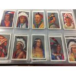 Cigarette Cards: Early 20th cent. album containing 19 sets of cards issued by Godfrey Phillips Ltd