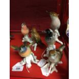 Karl Ens bird figures. Two birds on a branch and four other bird figures. (6).