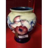 Moorcroft - The Newman Collection: c1935 Blue ground baluster shaped vase in the orchid pattern, 5½