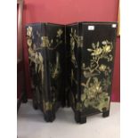 20th cent. Oriental black lacquered folding table screen with four panels. Ornately decorated with
