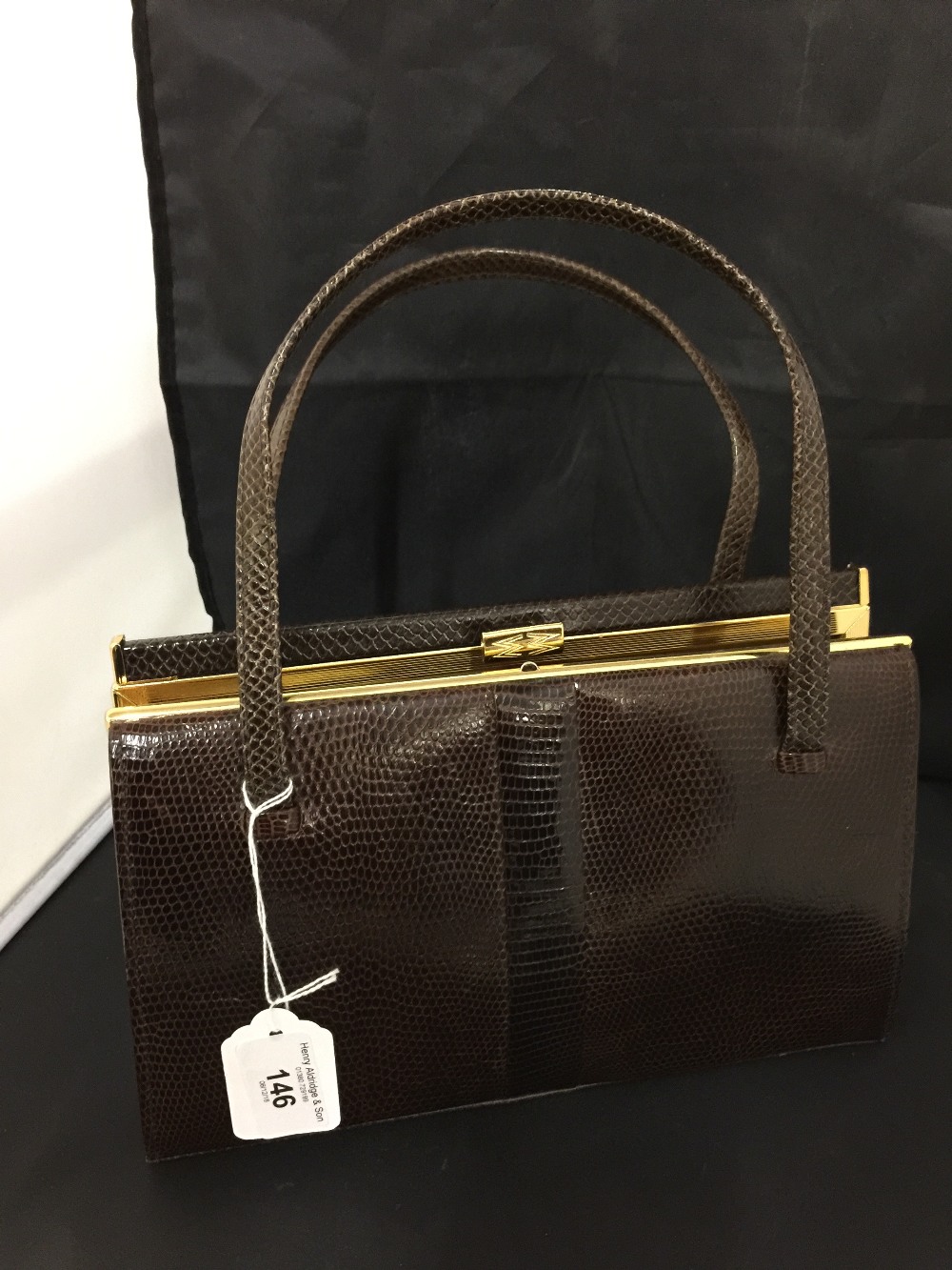 Fashion: Mappin & Webb, brown snakeskin handbag. Classic shape, suede lined, zip compartment. Mappin