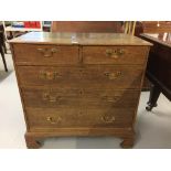19th cent. Oak chest of drawers of 2 short drawers over 3 drawers. The whole on bracket supports.