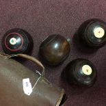 Sporting & Pastimes: Flat green 'lignum vitae' wooden bowls (5ins.) bias 3. One pair by Jaques & Son