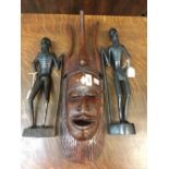 Tribal African hardwood, carved figures. Senegal of bearded male hunters plus a carved mask. (3)