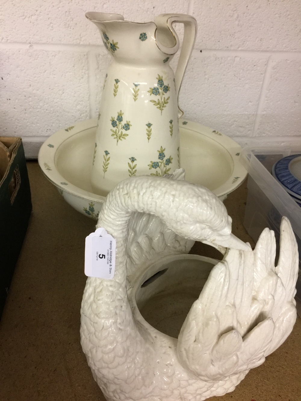 20th cent. Ceramics: F.W plus Co "Bourbon" pattern washbowl and jug and a swan flower basket