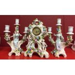 20th cent. German clock, garniture with muses, putti and floral decoration.