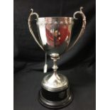 Hallmarked Silver: Two handled chalice. The rim and base decorated with Gothic style floral