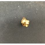 Yellow Metal: Scrap Tested 9ct. small fragment. 1 gram.