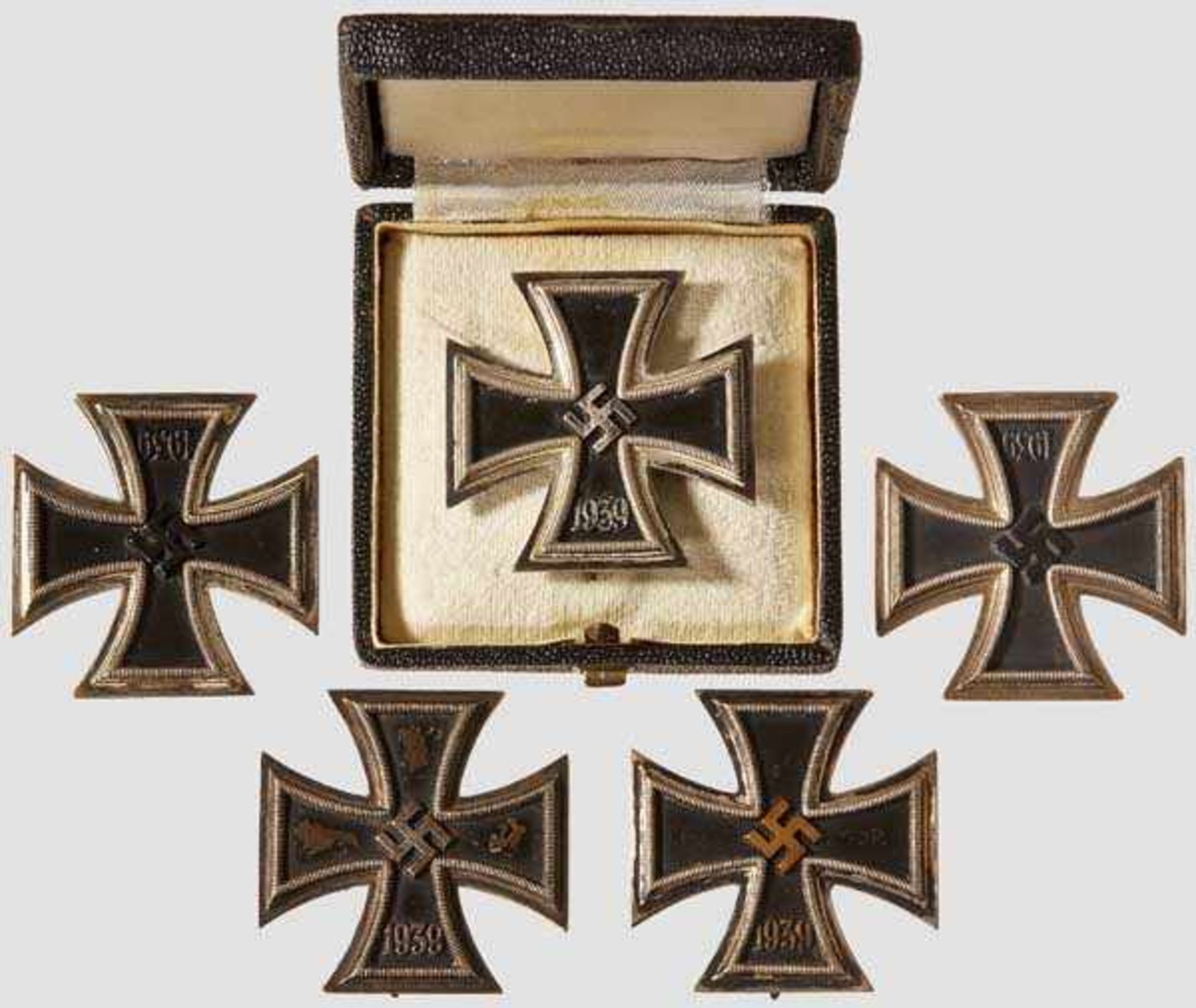 A Collection of Iron Cross 1939 I Class Five examples, each with black lacquered magnetic core in