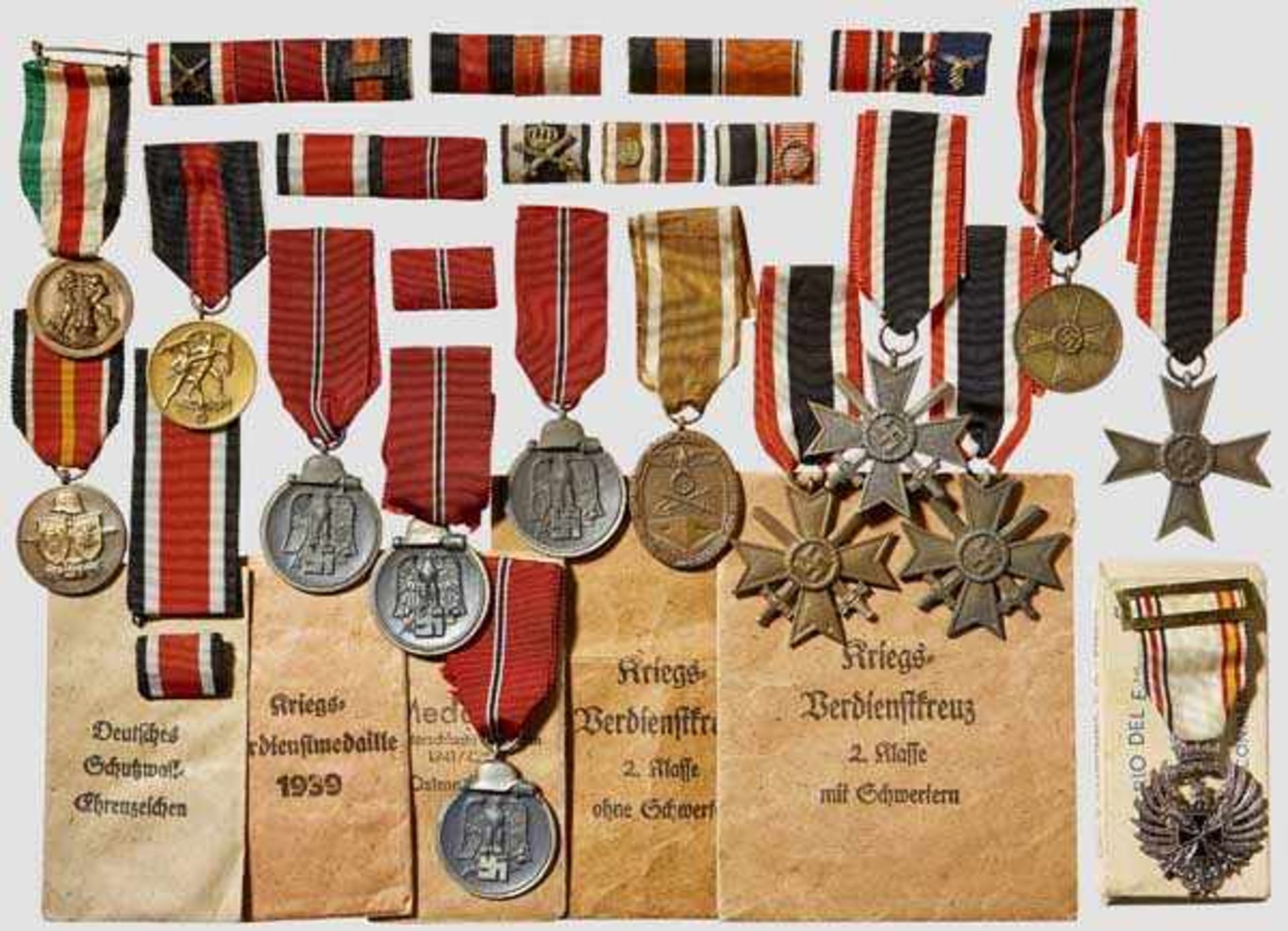 A Group of Medals Four East medals, West Wall medal, 1 October 1938 medal, three Kriegsverdienst