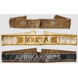 A Group of Three Campaign Cuff Titles Kreta, subtly ribbed, woven, white, cotton/rayon blend