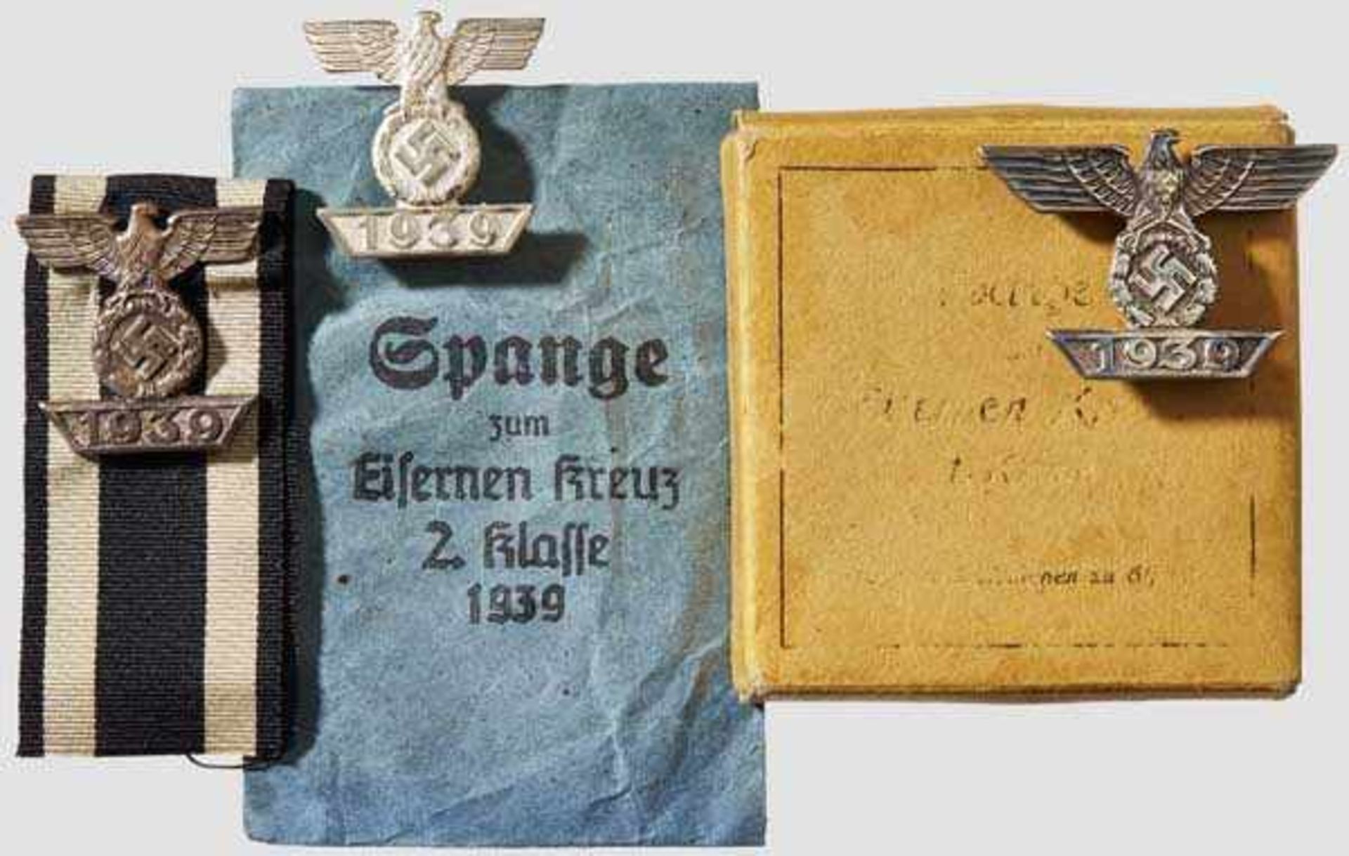 A Collection of Clasps to the Iron Cross 1939 Two 2nd class clasps (one on ribbon), one 1st class.