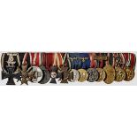 A Thirteen-Place Medal Bar Comprising: 1914 Iron Cross 2nd Class with 1939 Spange, War Merit Cross