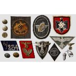 A Grouping of Political Insignia An NSKK traffic educator sleeve badge, NSKK driver's diamond sleeve