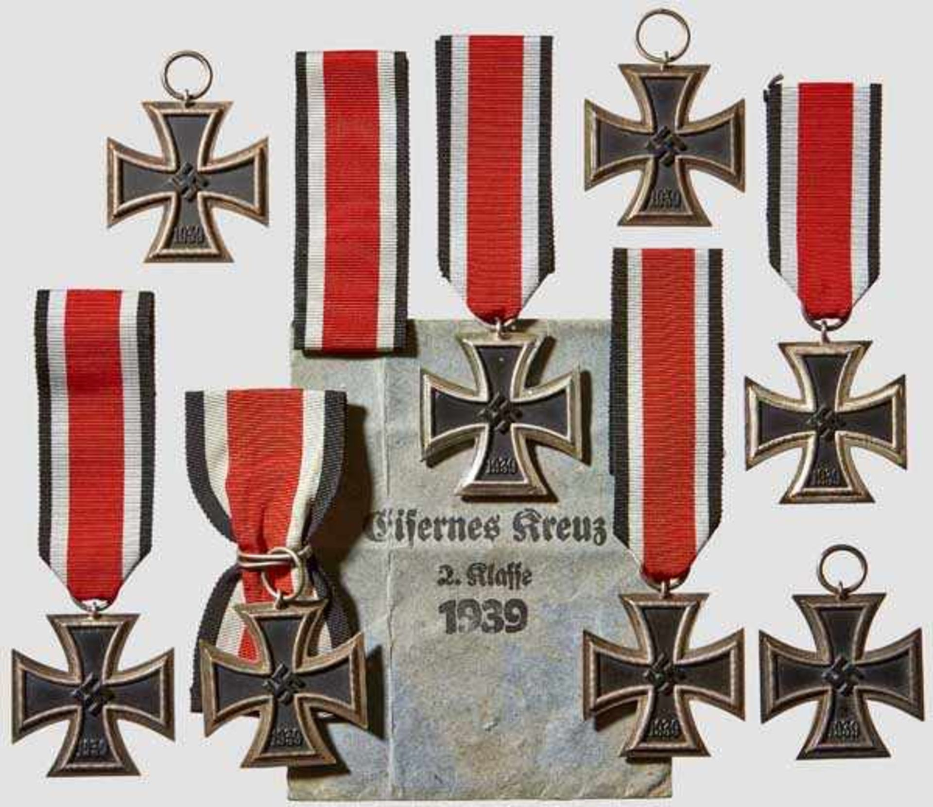 A Collection of Iron Cross 1939 II Class Eight examples each with black lacquered magnetic core in