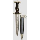 A Model 1933 SS Service Dagger Maker Bo?ker, Solingen. Polished blade exhibits age with etched motto