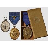 A Collection of RAD Long Service Awards Boxed bronzed fourth class, 4-year medal on blue ribbon with