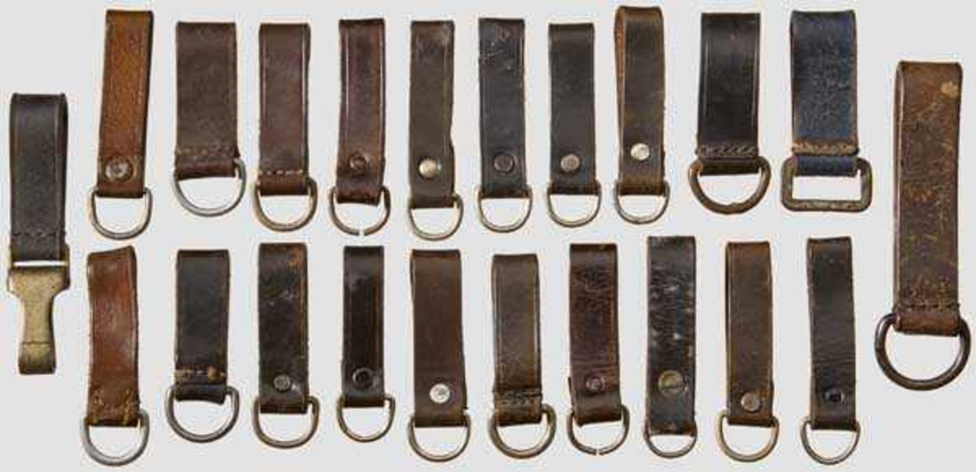 A Group of Twenty-Two {D{ Ring Dagger and Equipment Belt Loops Eleven dagger loops, seven brown