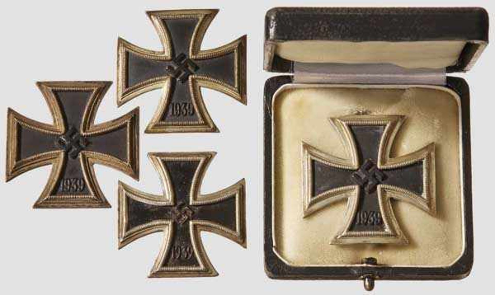 A Collection of Iron Crosses 1939 I Class Four examples two with black lacquered magnetic core,