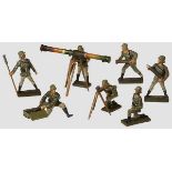 A Lineol 7 Figure Crew for Heavy Howitzer Lineol, 7cm series, all figures exhibit minor cracks and