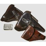 Three Pistol Holsters Three holsters made of various grain leathers, various manufacturers,