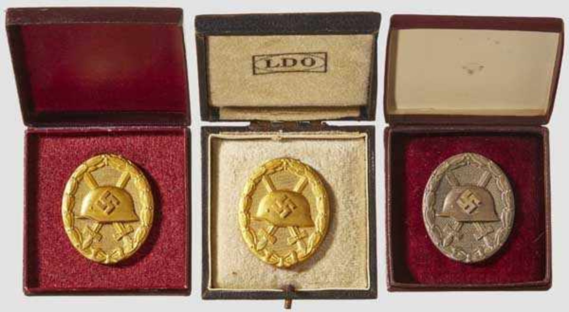 A Collection of Wound Badges Two gilded tombak, one stamped {L/12{ below catch representing C.E.