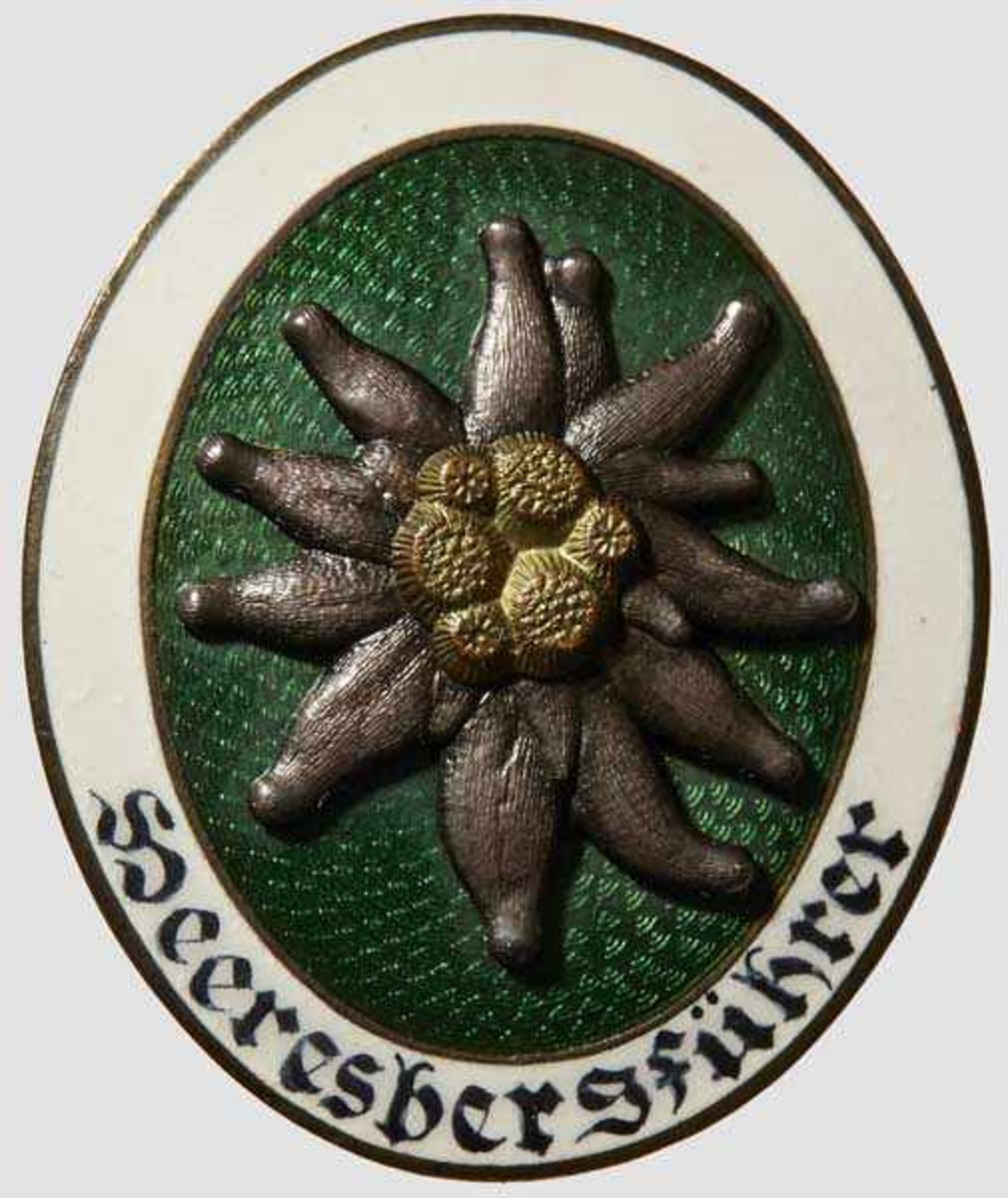 Army Mountain Guide Badge Convex gilded tombak with white and green enamels. Two-piece edelweiss