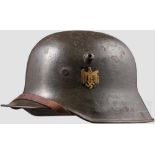 Stahlhelm M 18 der Kriegsmarine mit einem Abzeichen Feldgrau übermalte Glocke mit zu ca. 75 %